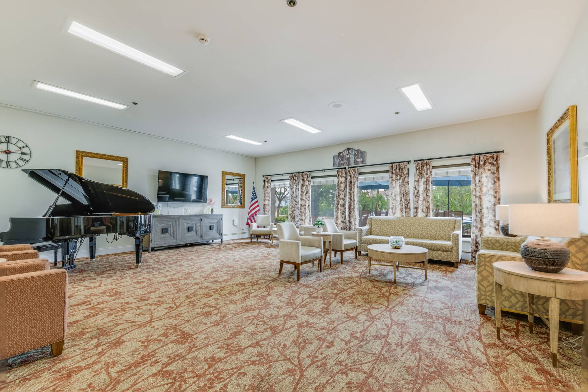 Common area with seating and a piano.