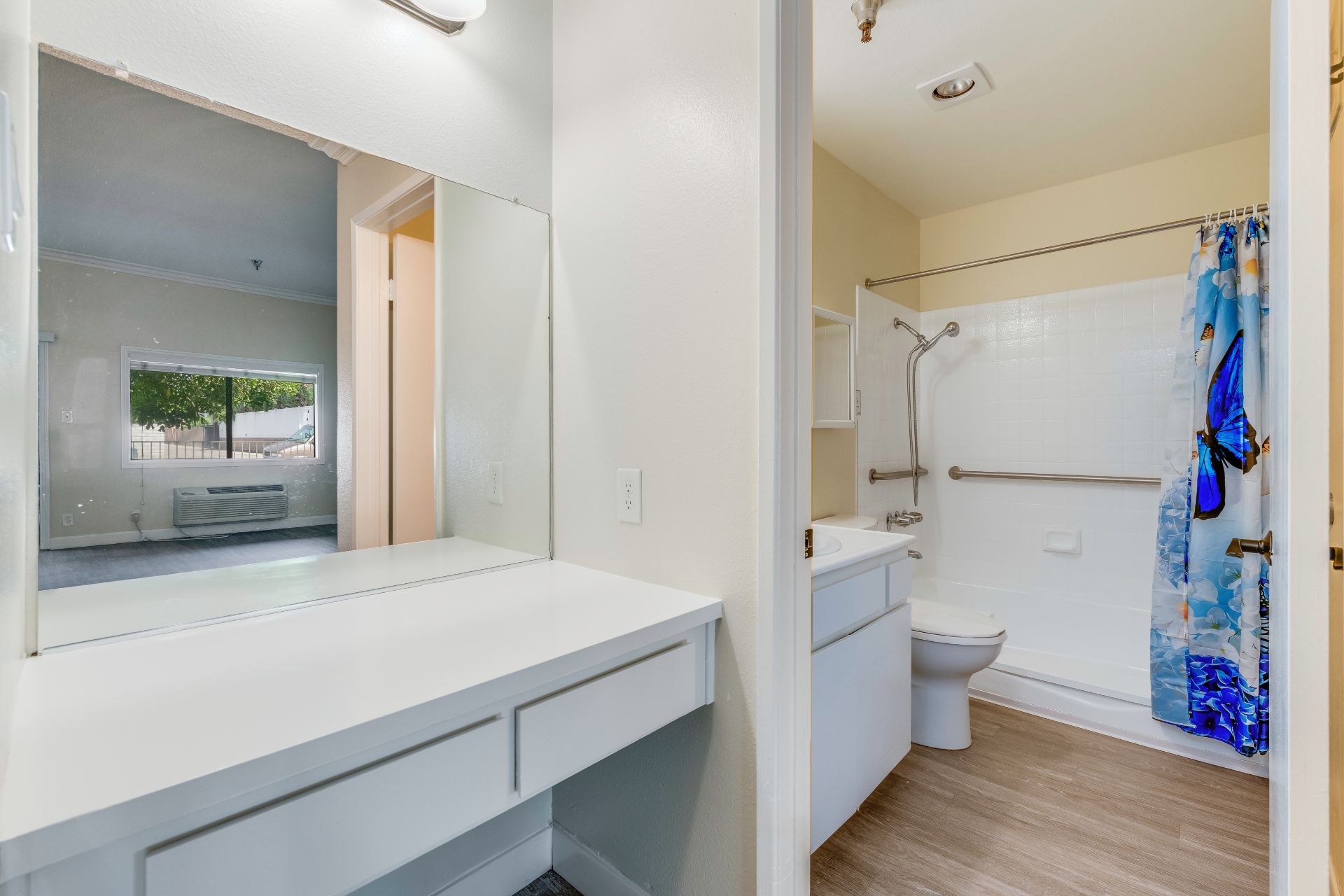 Private resident bathroom with shower and vanity