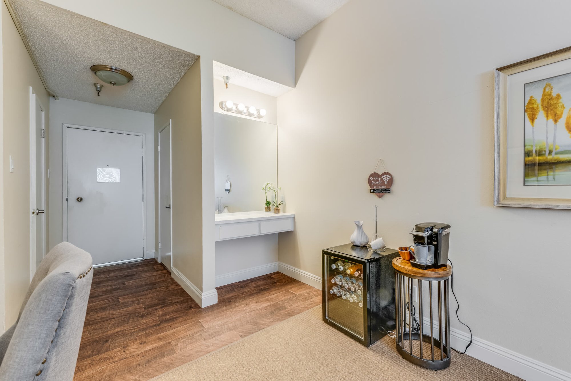Welcoming entrance area with coffee station and decor