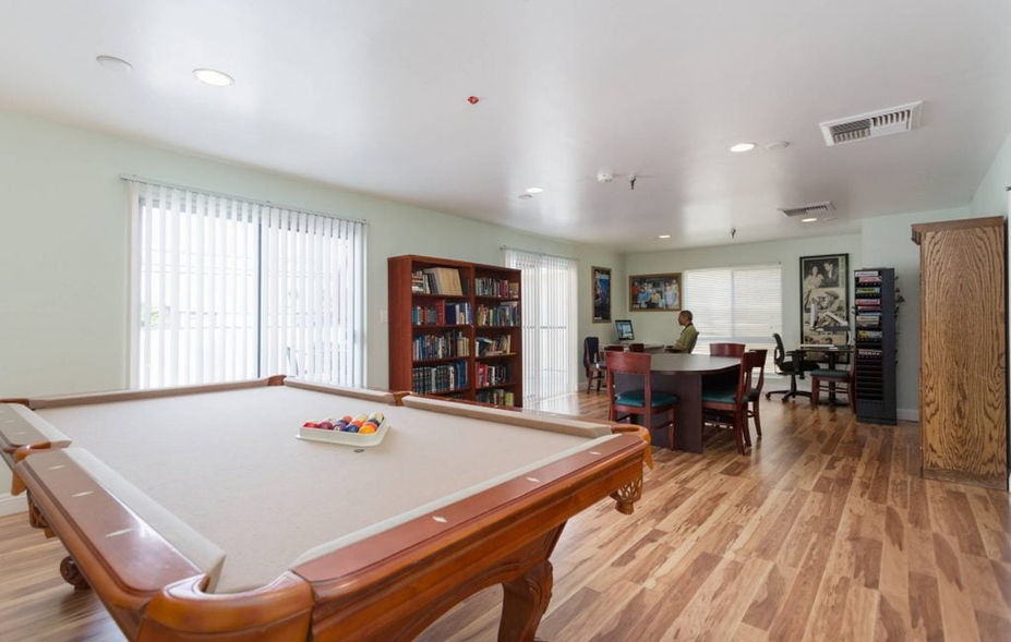 Common area with pool table and seating