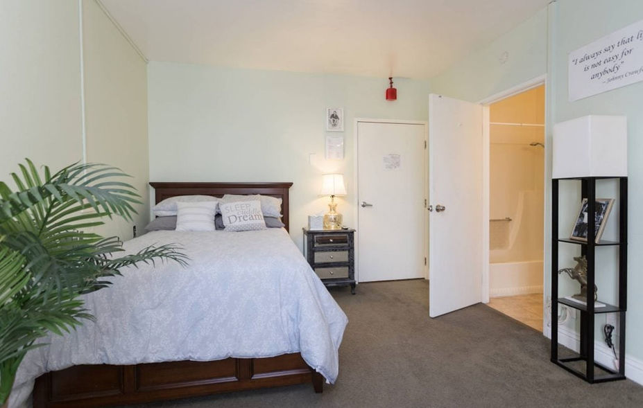 Cozy private resident bedroom with calming decor.