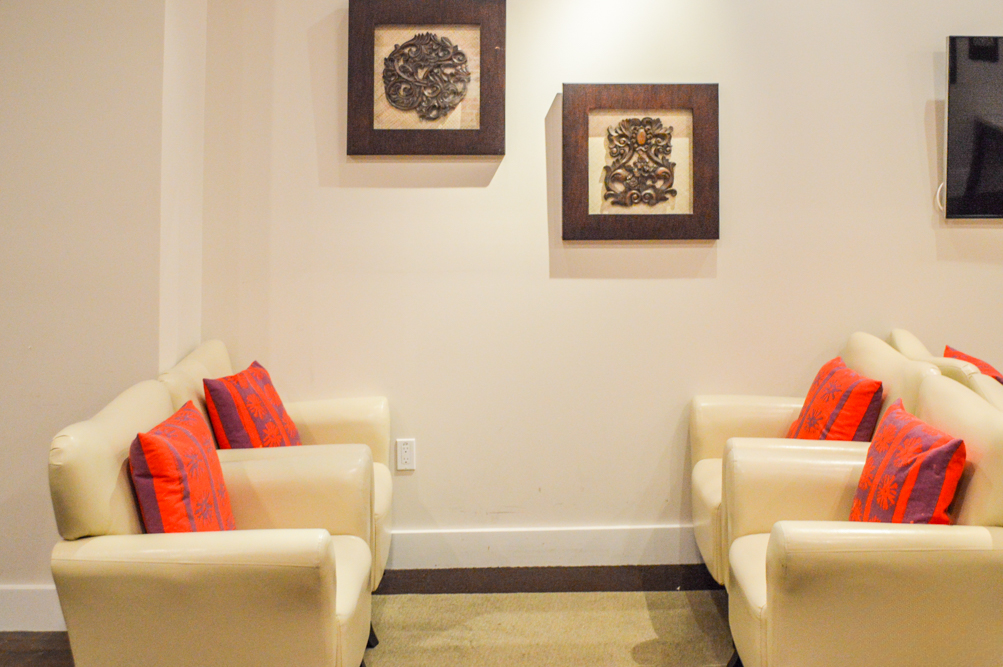 Cozy seating area with decorative wall art.