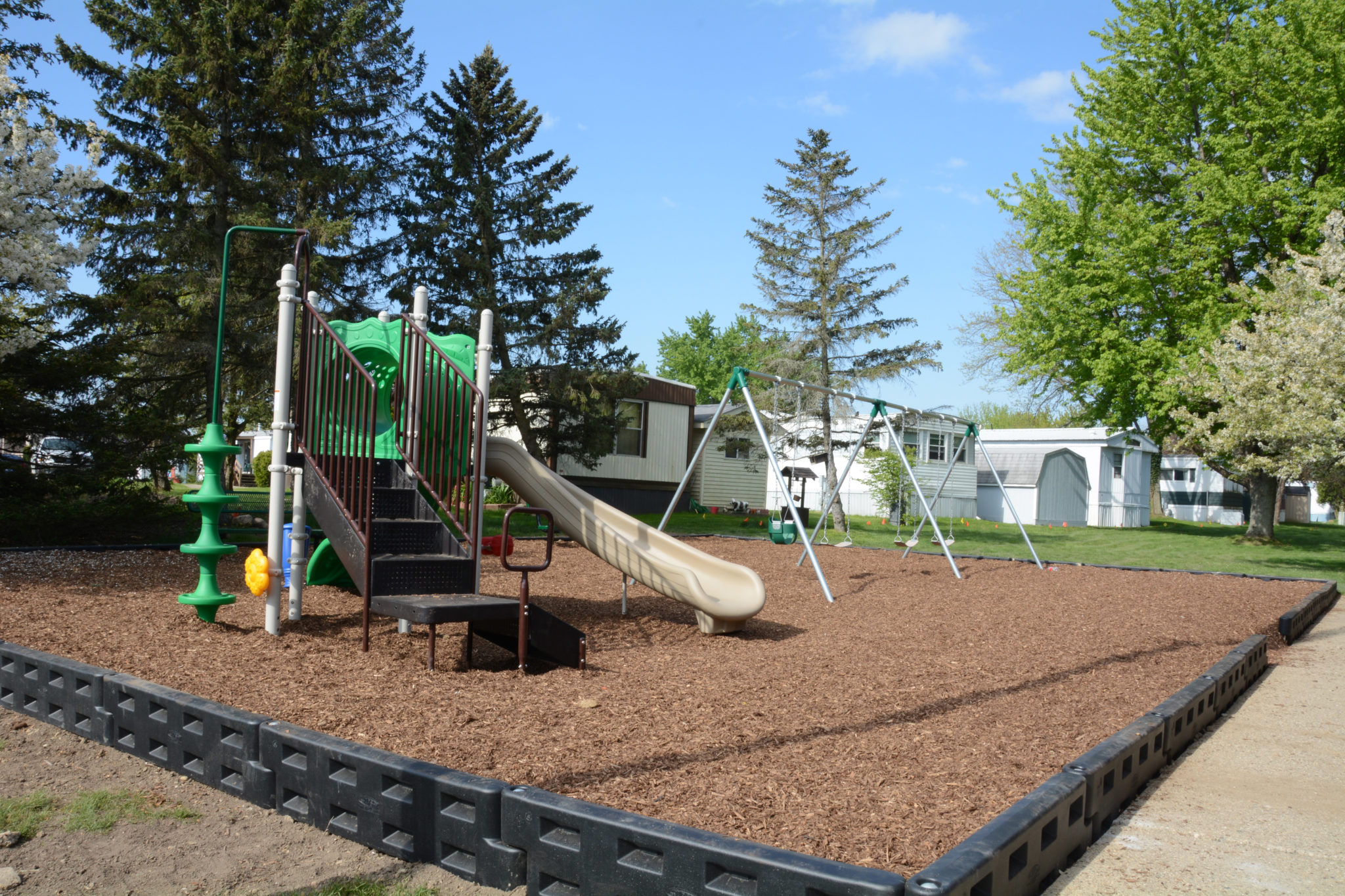 Outdoor playground with slides and swings