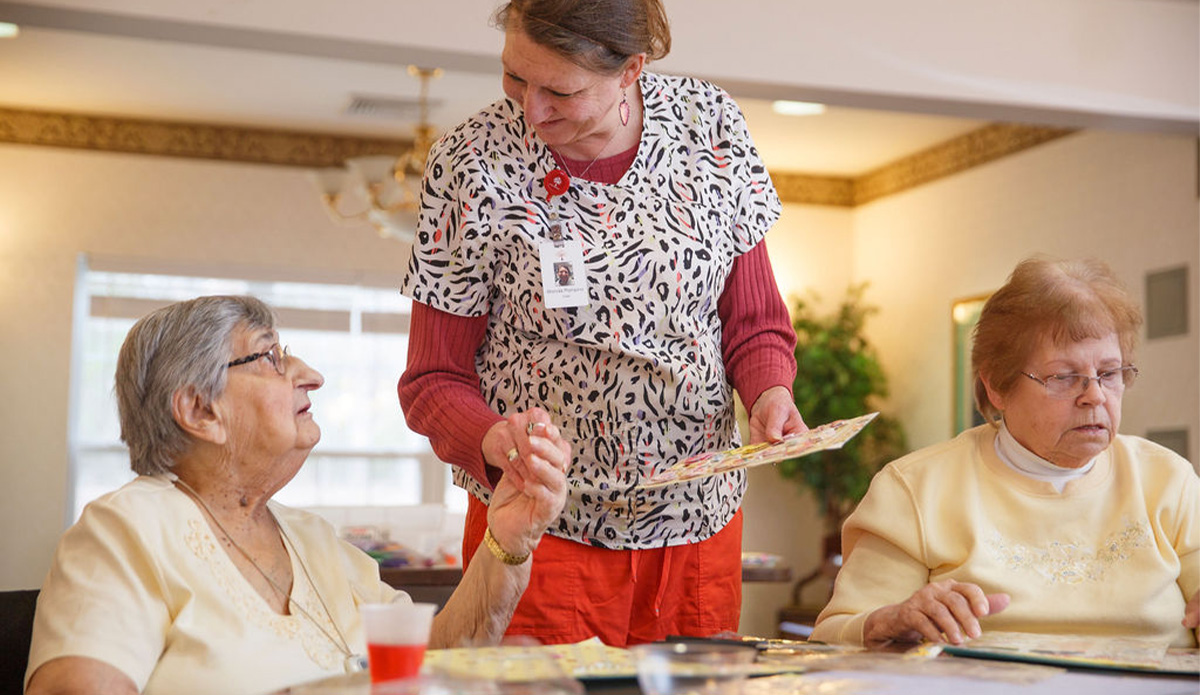 Staff engaging with residents during an activity.