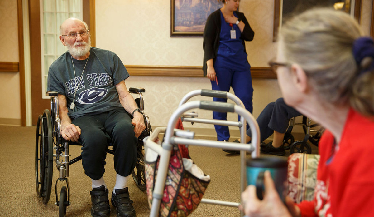 Residents engaging in conversation in a common area.