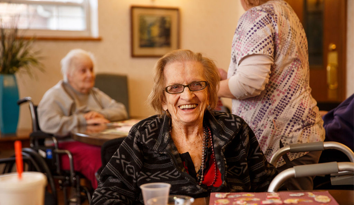 Happy residents engaged in a common area.