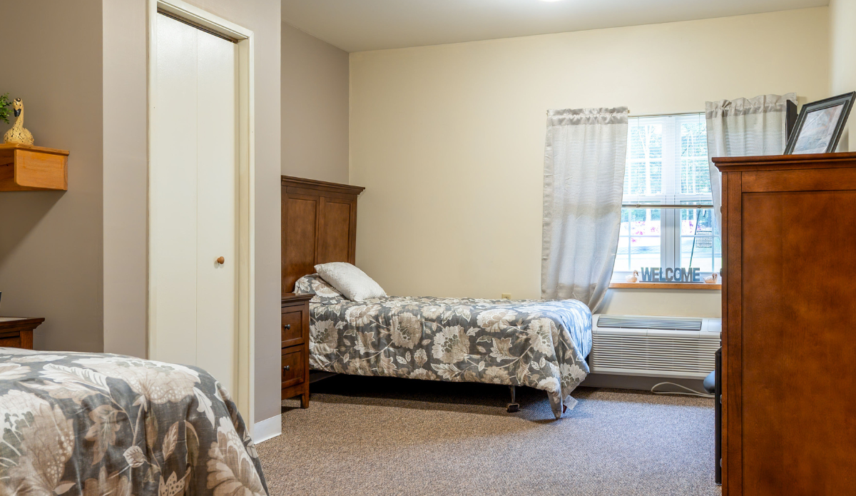 Cozy resident room with floral bedding