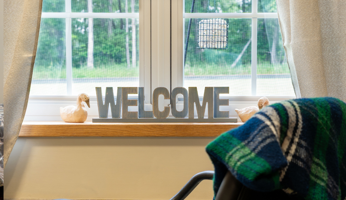 Welcome sign in a cozy interior setting