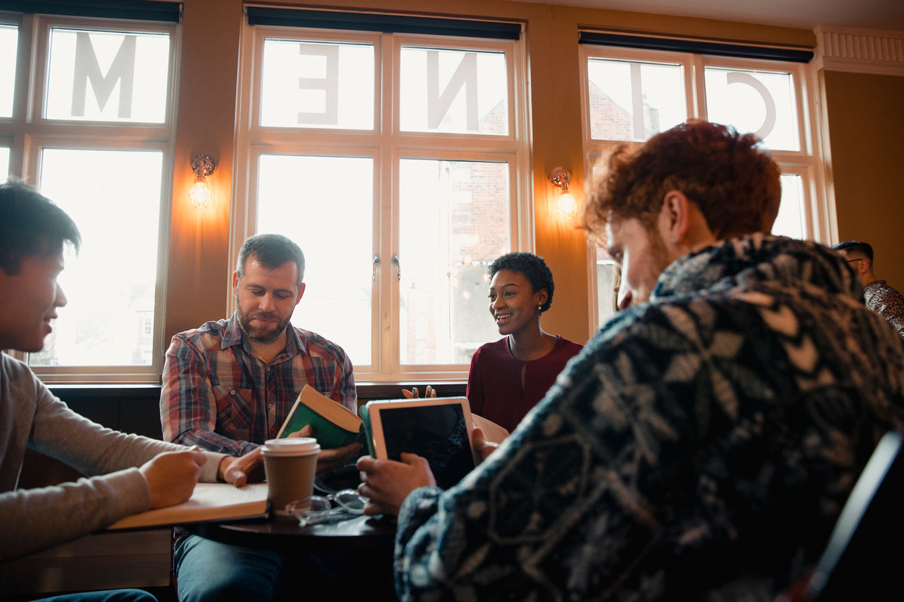Residents engaging in conversation at a table