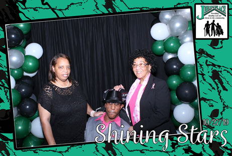 Residents celebrating with balloons at an event.