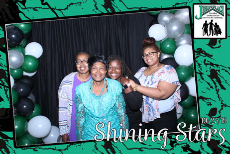 Residents and staff celebrating at an event.