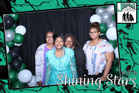 Group of women posing for a photo at an event