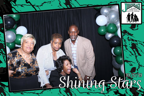 Group of four people at an event celebration.
