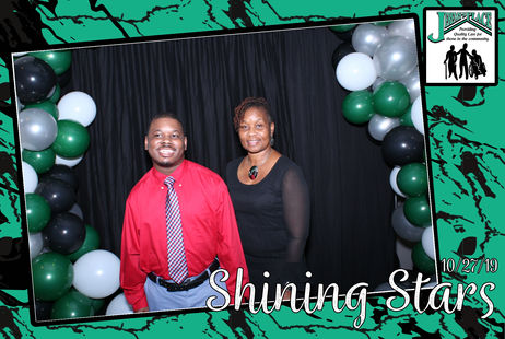 Two individuals posing at an event