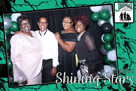 Four women celebrating at a Shining Stars event