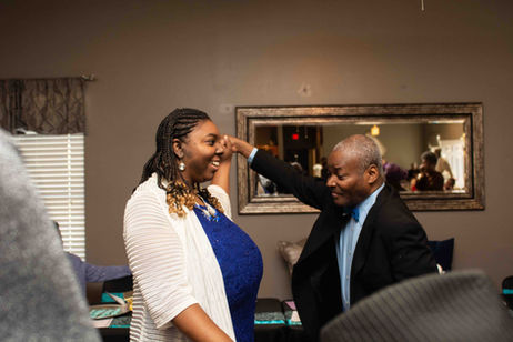 Two residents dancing in a common area
