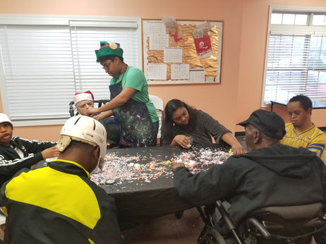 Residents and staff engaged in a craft activity.
