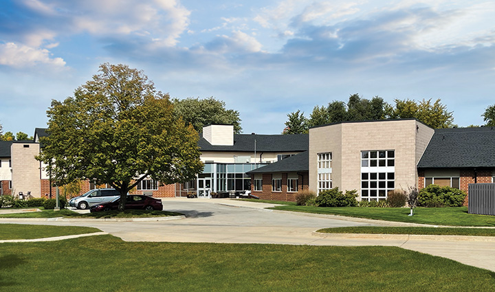 Exterior view of the facility with landscaped grounds.
