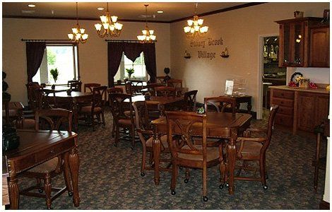 Dining area with wooden tables and chairs.