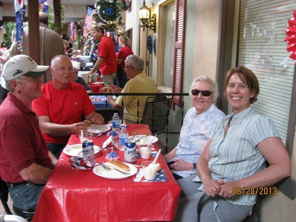 Residents enjoying a meal together outdoors