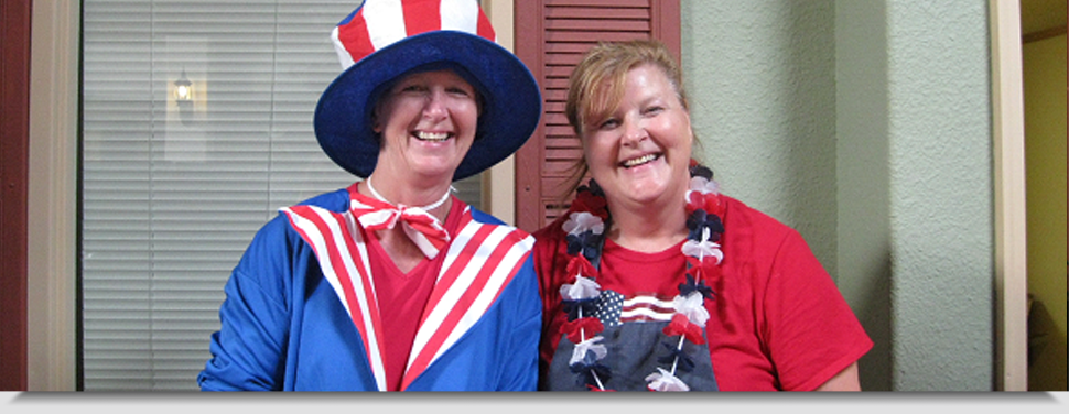 Two staff members dressed for a festive event