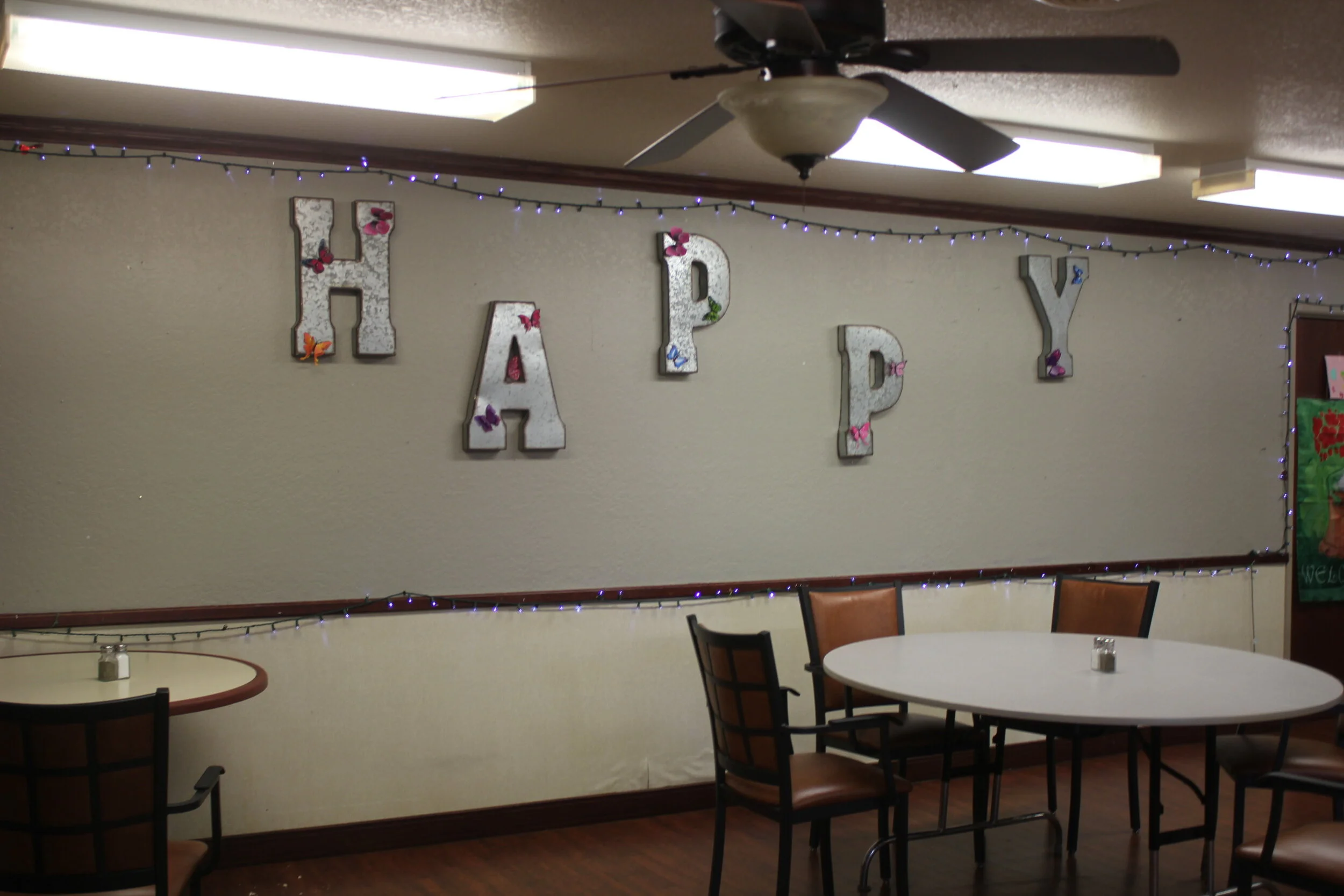 Common area decorated with 'HAPPY' letters