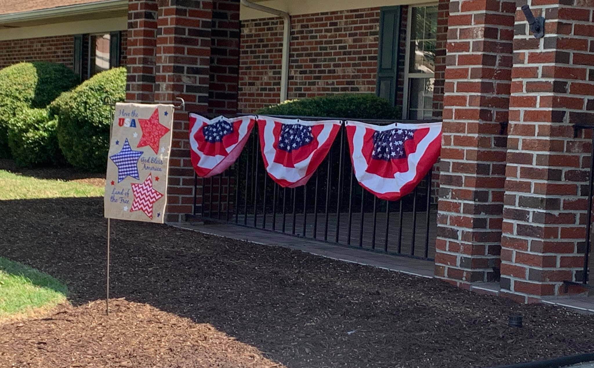 Decorative patriotic bunting and signage outside the facility