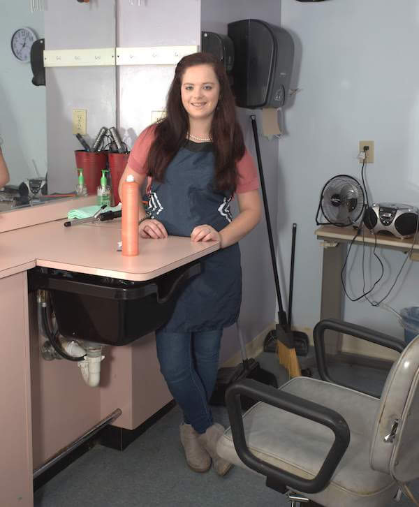 Hair salon scene with a stylist