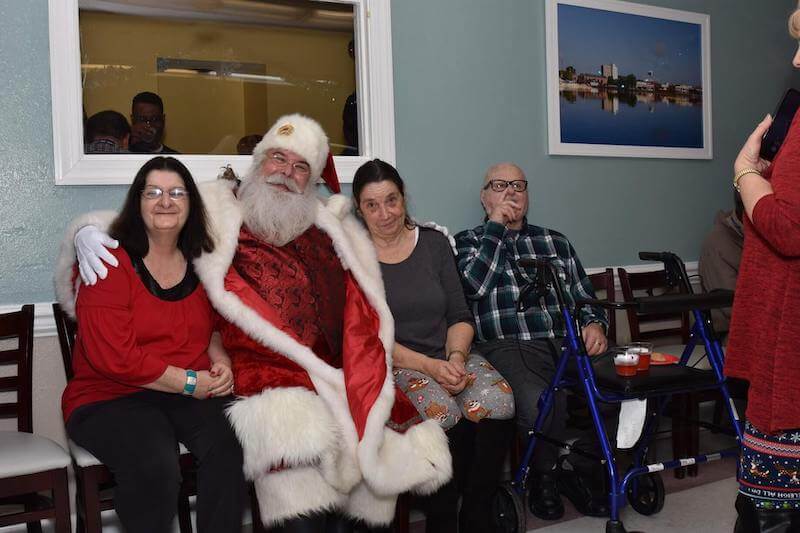 Residents enjoying holiday celebration with Santa