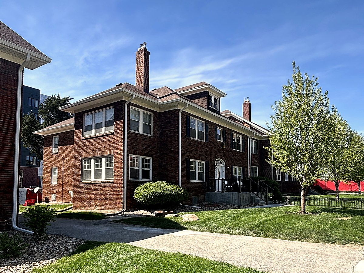 Exterior view of a brick building with landscaping