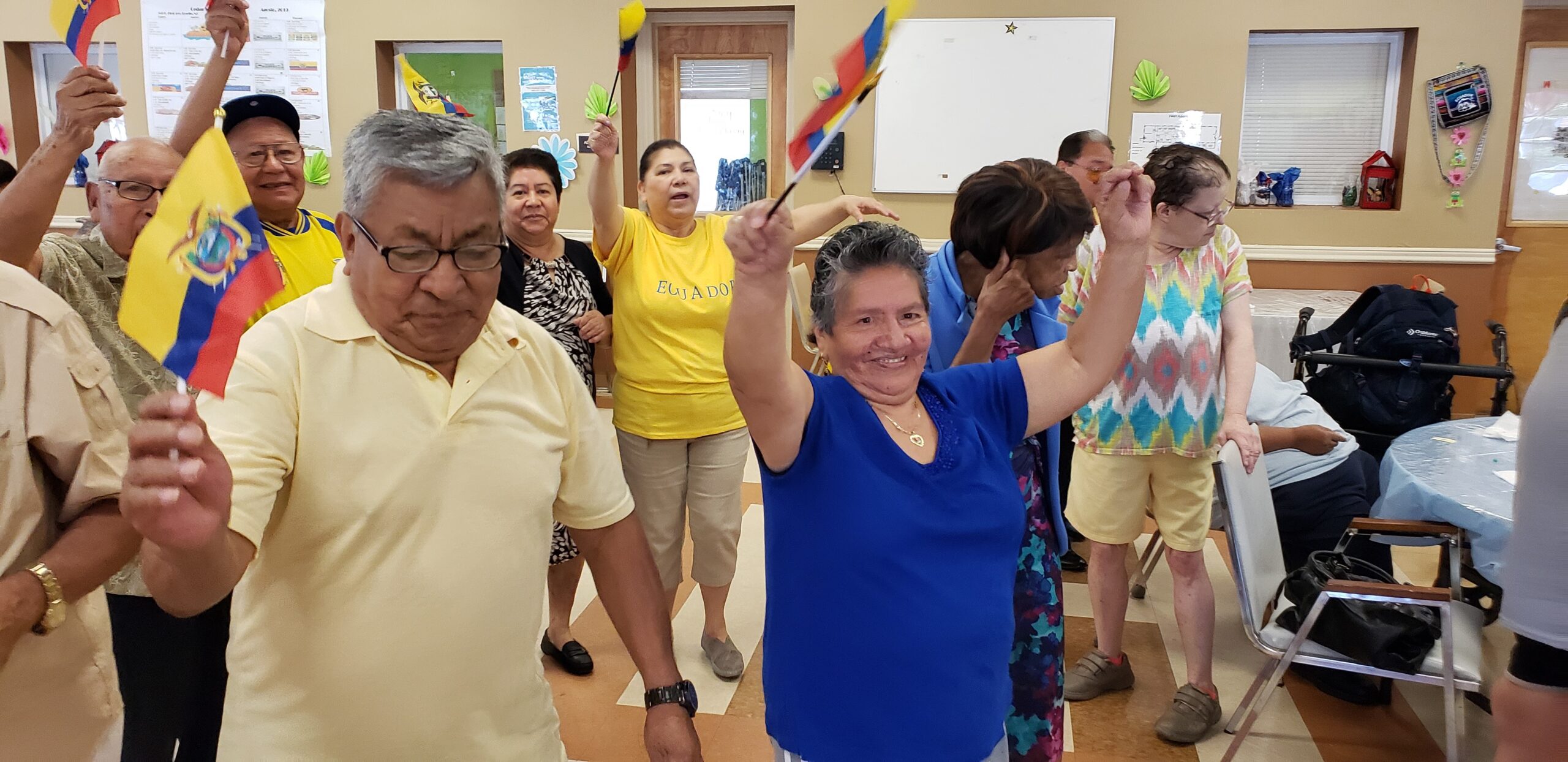 Residents celebrating with flags during an activity