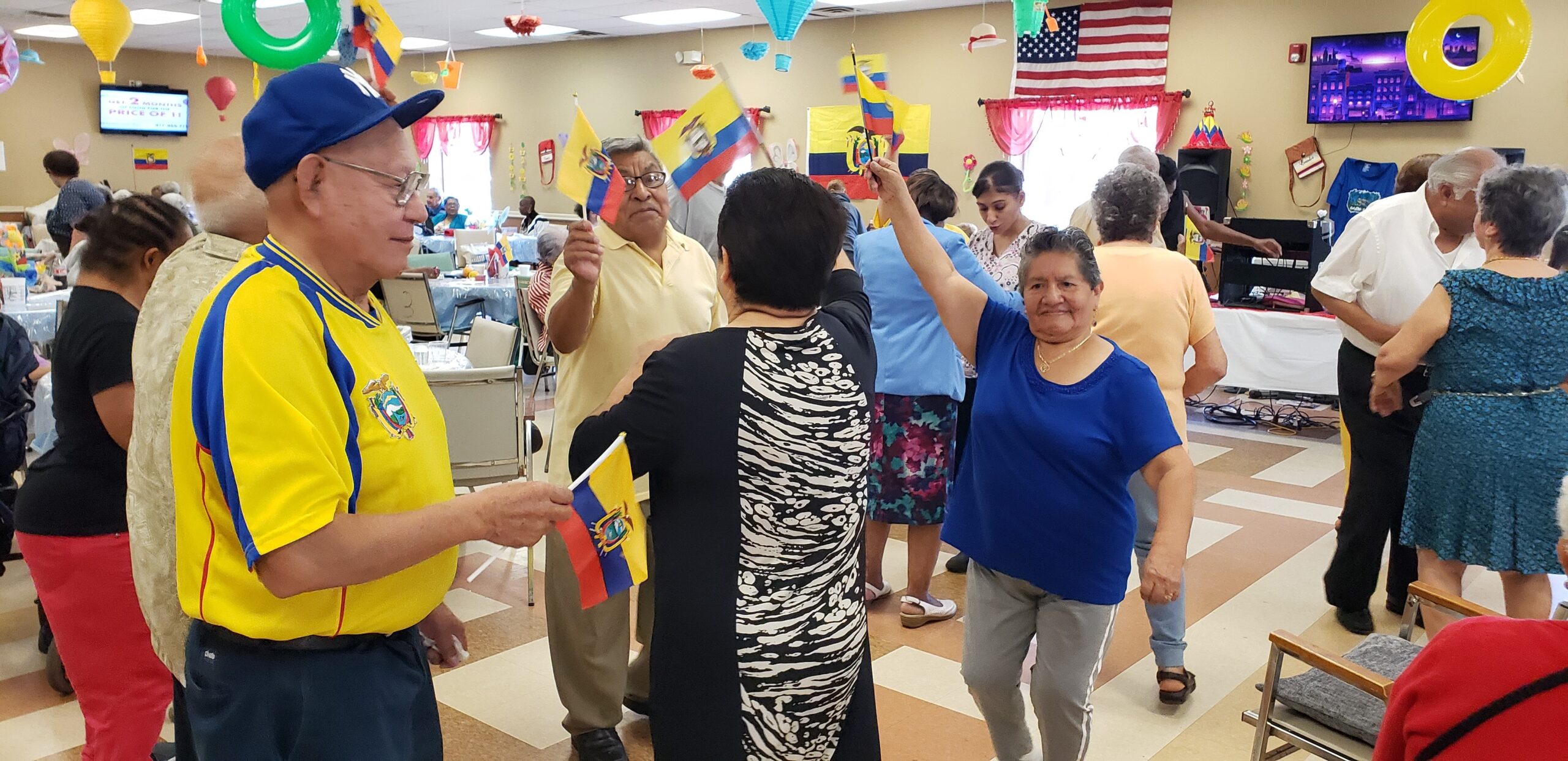 Residents enjoying a festive celebration indoors.