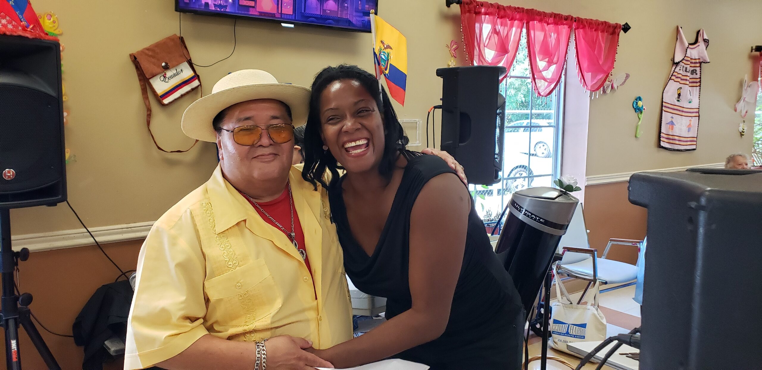 Two people smiling together at a celebration