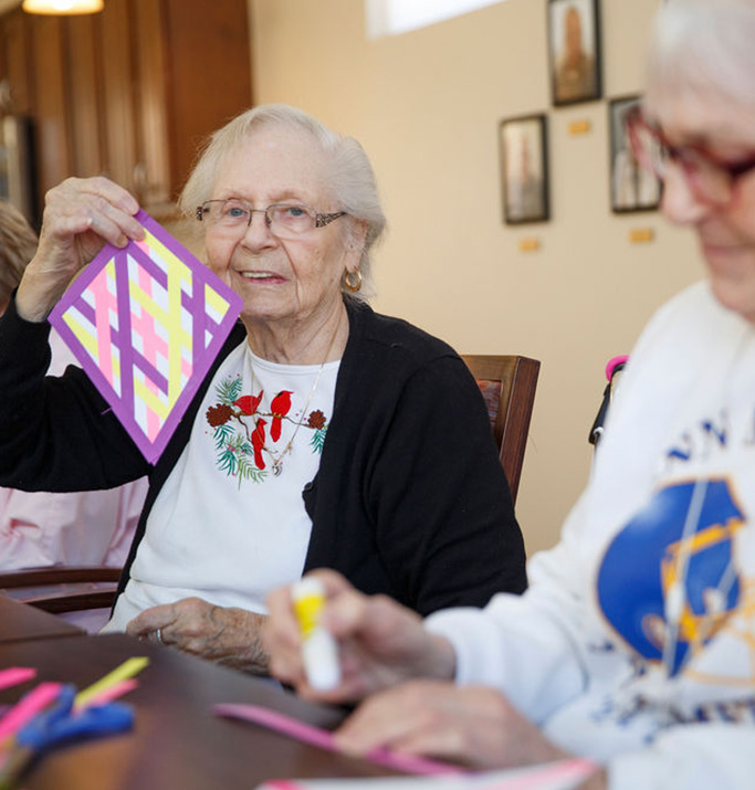 Residents engaging in an arts and crafts activity.