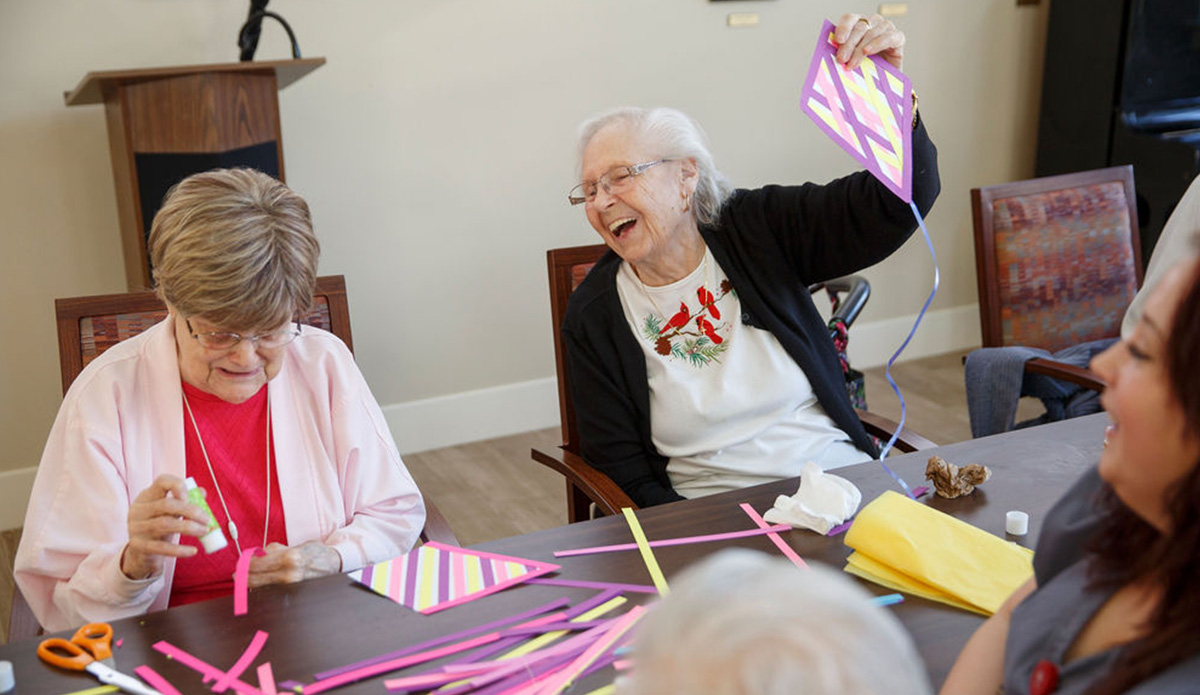 Residents engaged in a crafting activity.