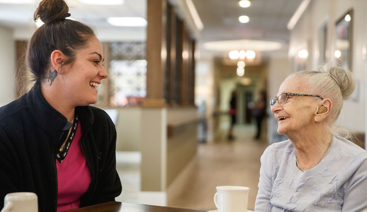 Staff member engaging with a resident in the facility