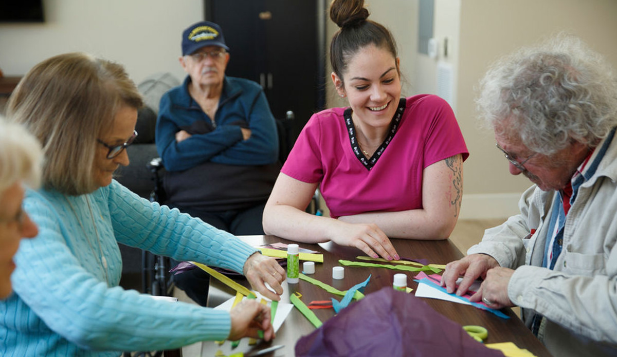 Residents and staff engaging in a creative activity.