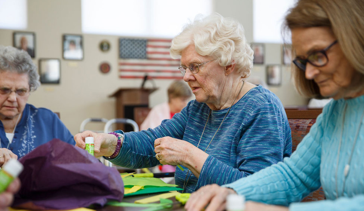 Residents participating in a craft activity.