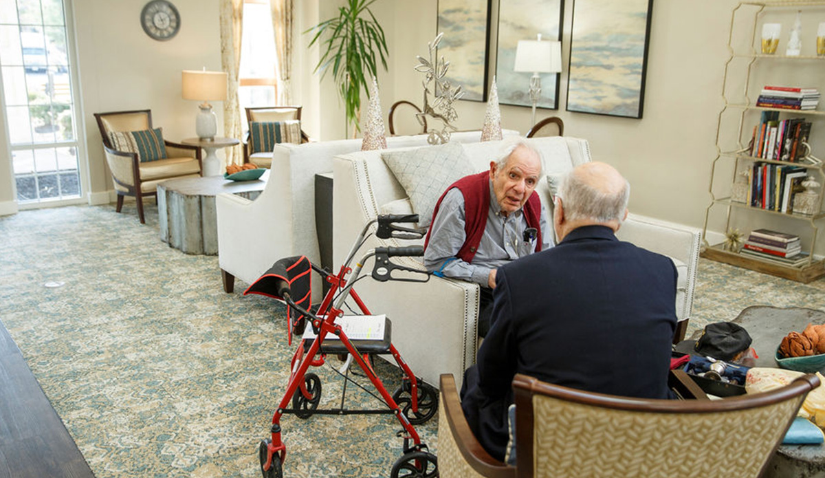 Residents engaging in conversation in a common area