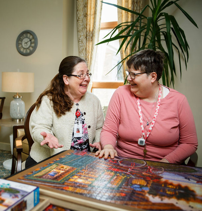 Residents engaging in a puzzle activity.