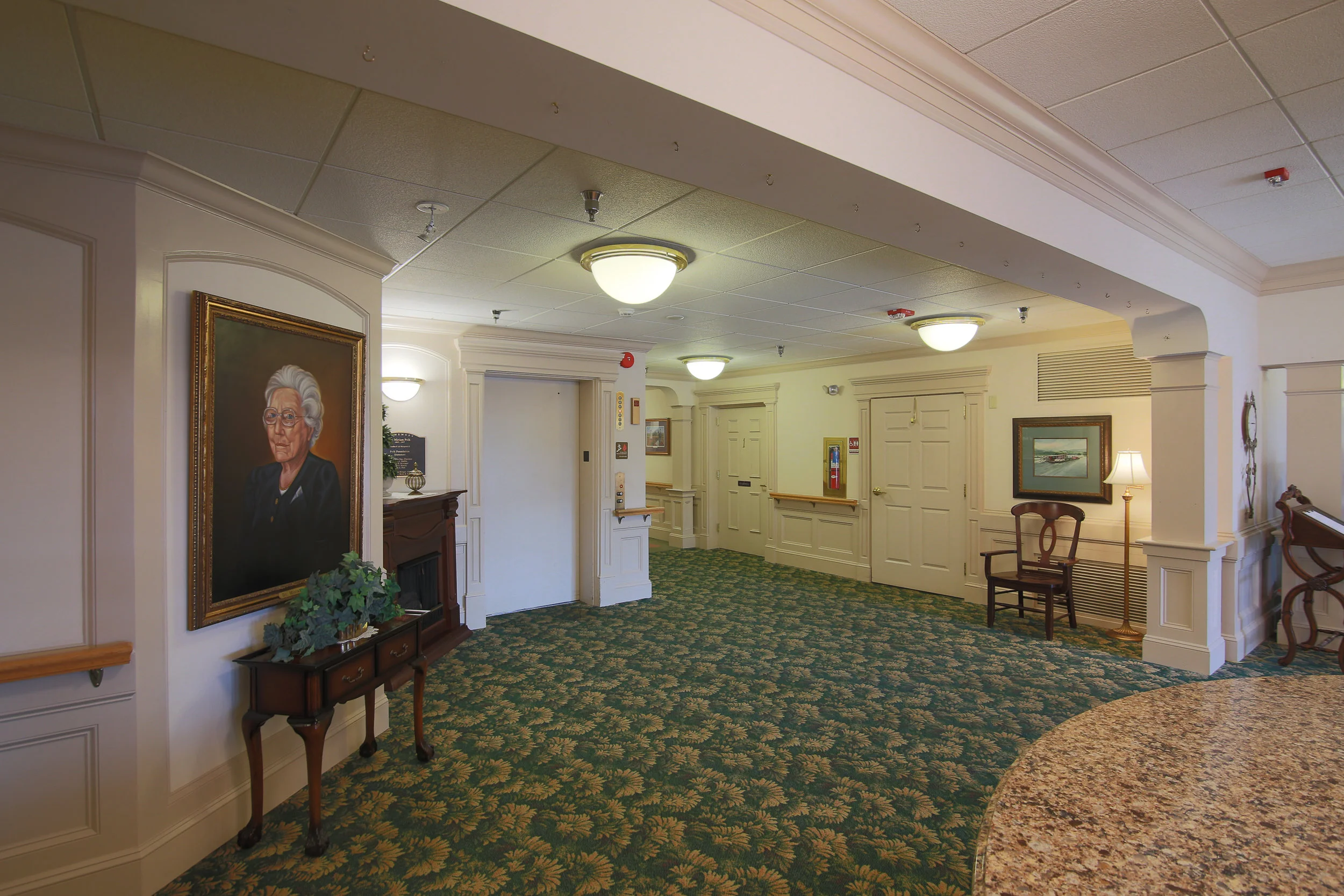 Interior view of a common area with a painting.
