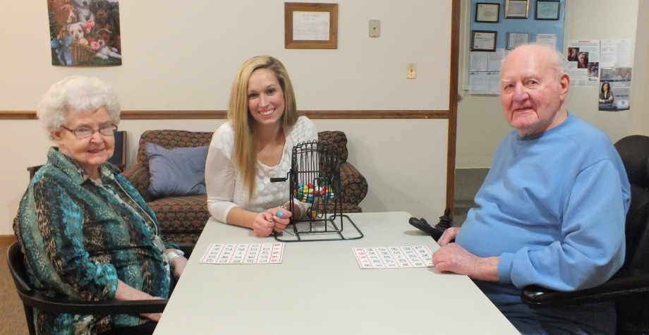 Residents and staff playing bingo together