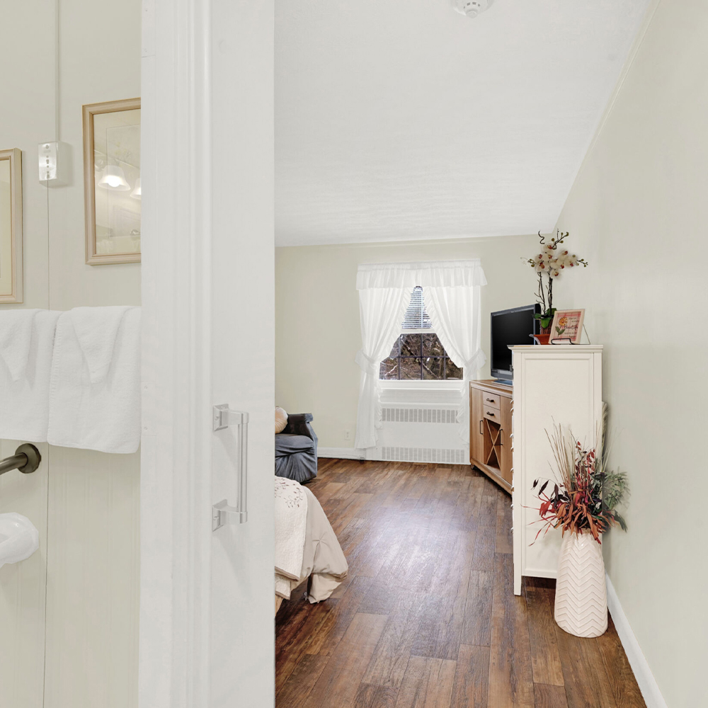 Comfortable resident room with warm decor