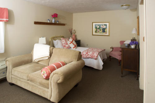 Cozy resident room with furniture and decor.