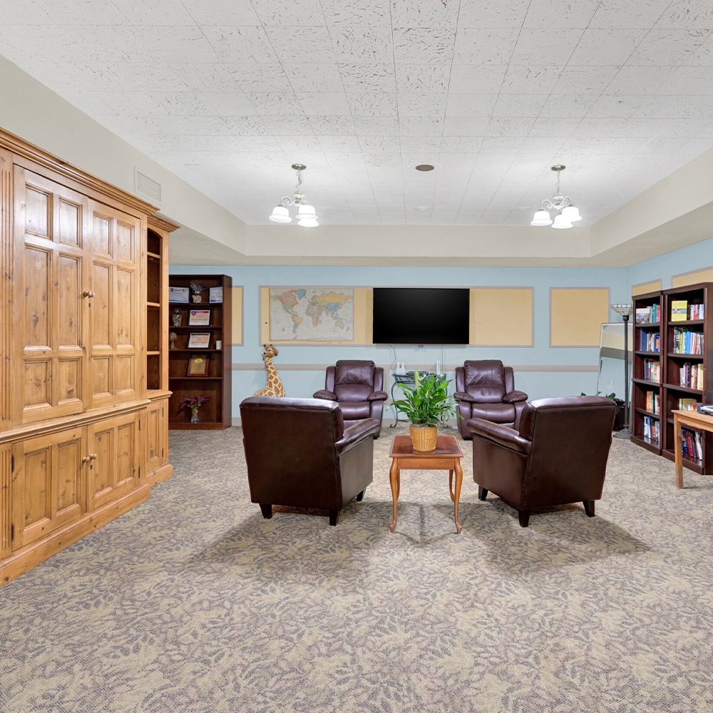 Common area with seating and bookshelves