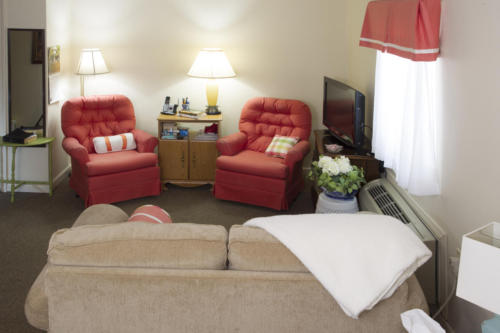 Cozy seating area in a resident's room.