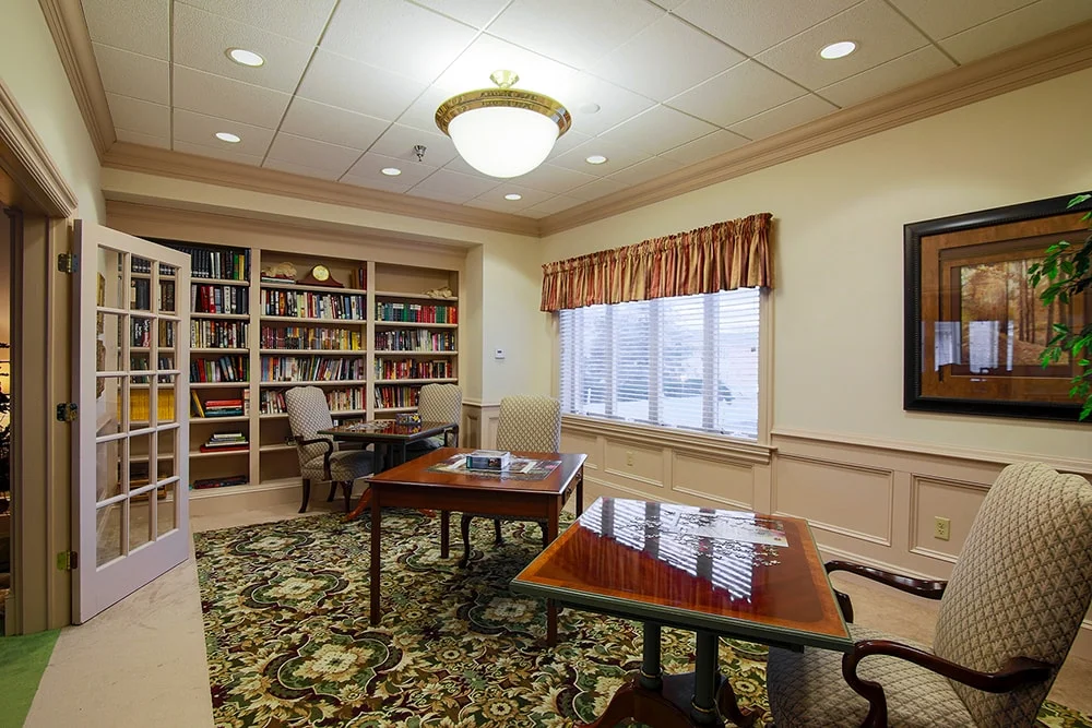 Cozy common area with bookshelves and seating