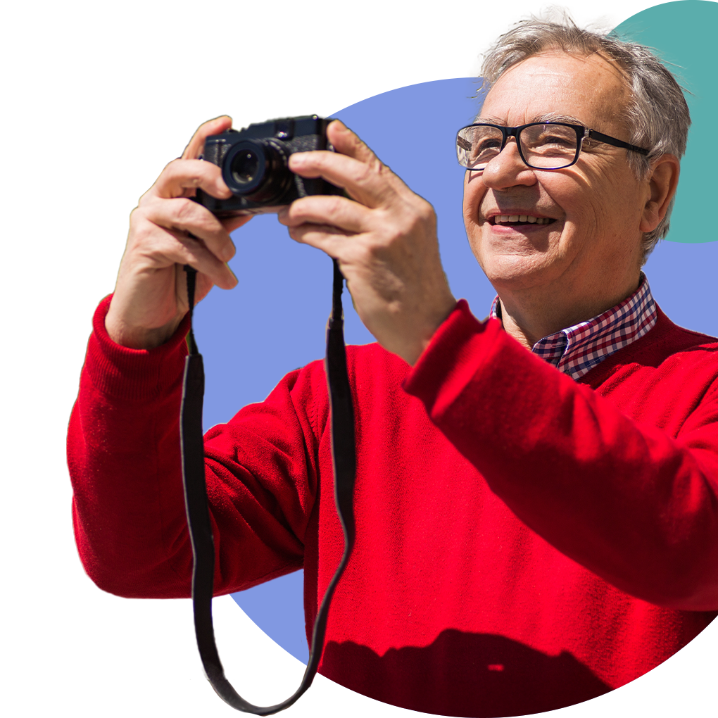 Senior man taking photos outdoors