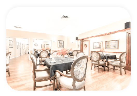 Dining area with tables and chairs set for a meal