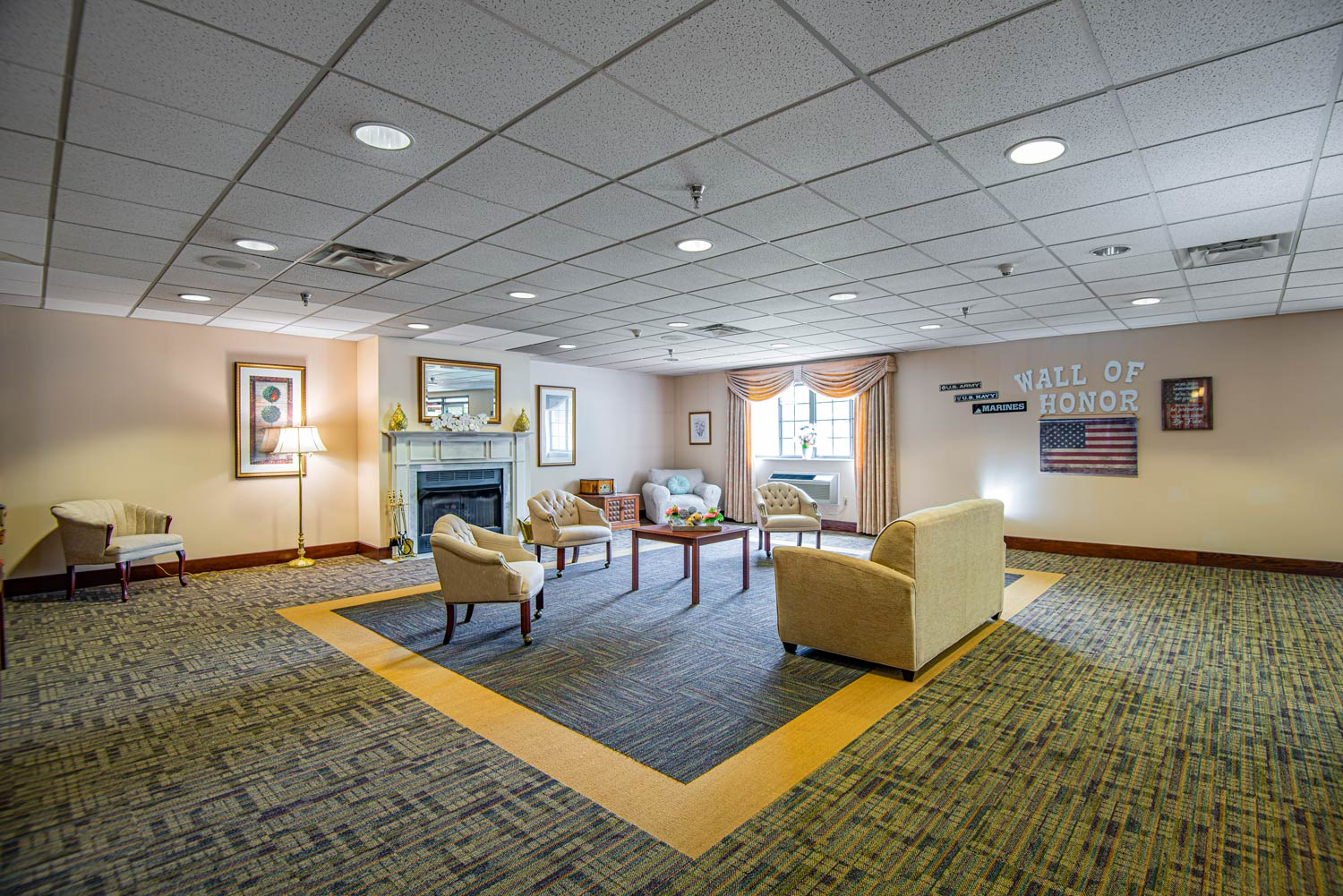 Common area with seating and decorative wall